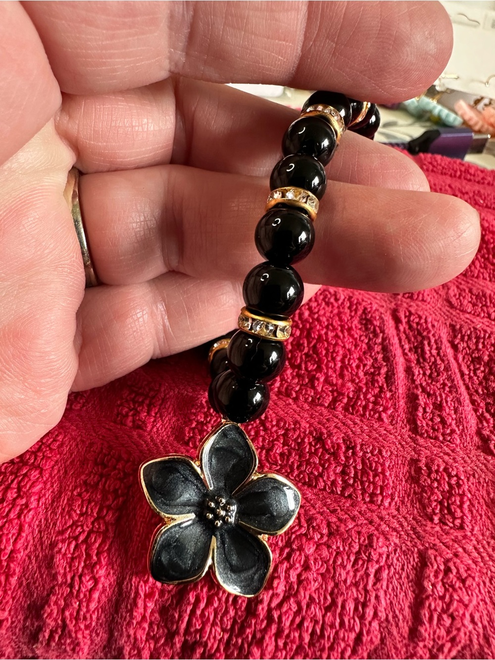 Women's Black Beaded Bracelet with Black Flower Charm - Gold Accents